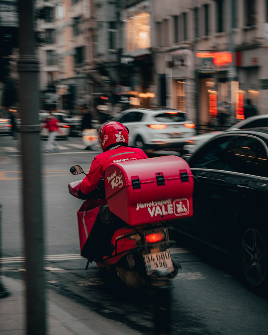 red-and-black-motorcycle-on-road-during-daytime-0gjx7yvv5as